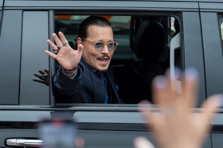 FILE - Actor Johnny Depp waves to supporters as he departs the Fairfax County Courthouse during his high-profile libel lawsuit against ex-wife Amber Heard, on May 27, 2022 in Fairfax, Virginia. Depp was the most Googled person of 2022 in the United States. (AP Photo/Craig Hudson, File)