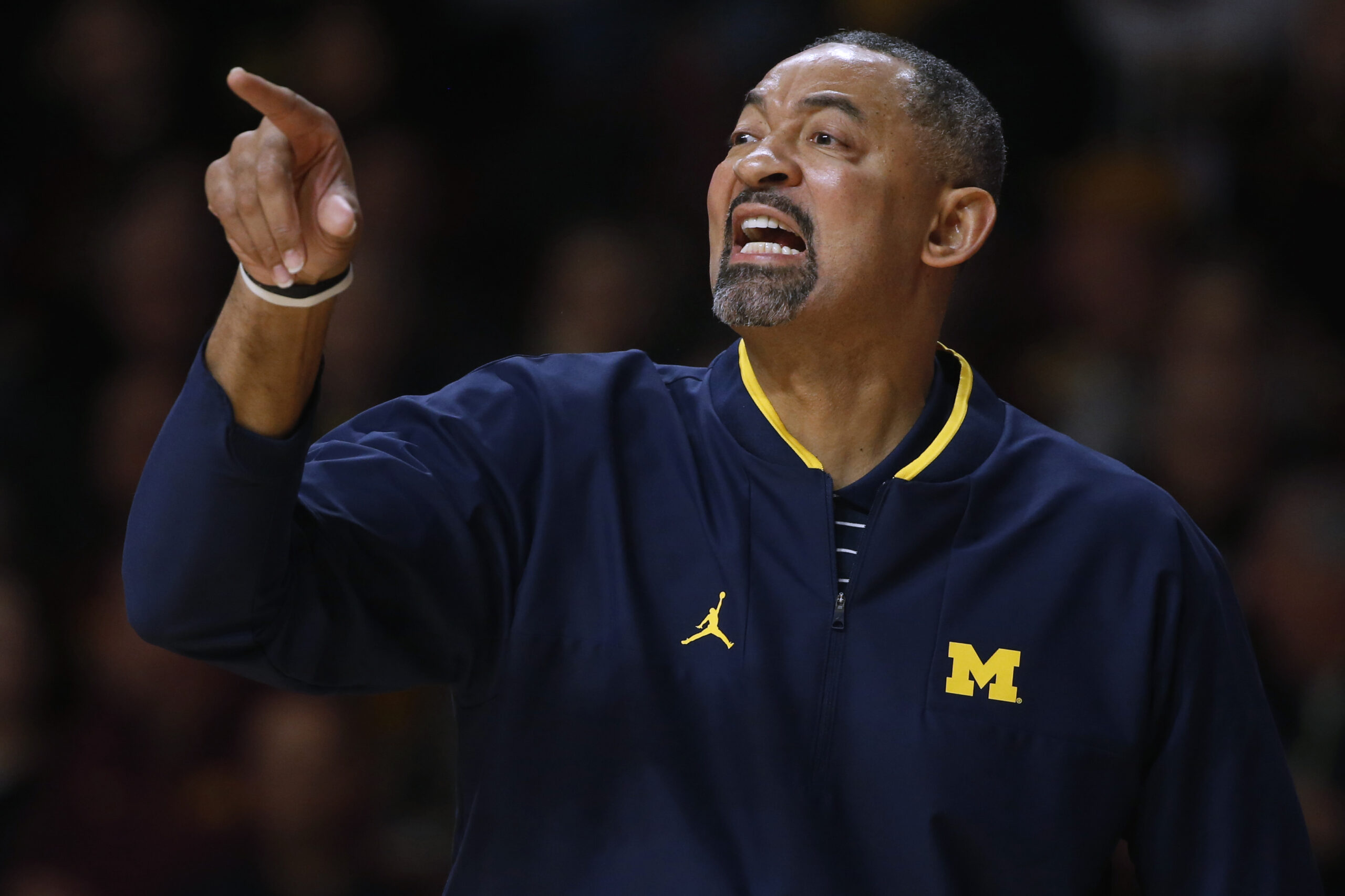 WATCH: Michigan coach Juwan Howard gets restrained and swears at own players during defeat