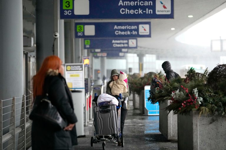 Travelers arrive at Terminal 3 at O'Hare International Airport in Chicago.  