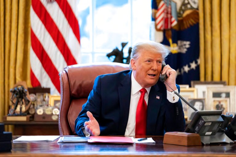 In this image released in the final report by the House select committee investigating the Jan. 6 attack on the U.S. Capitol, on Thursday, Dec. 22, 2022, President Donald Trump talks on the phone to Vice President Mike Pence from the Oval Office of the White House on the morning of Jan. 6, 2021.
