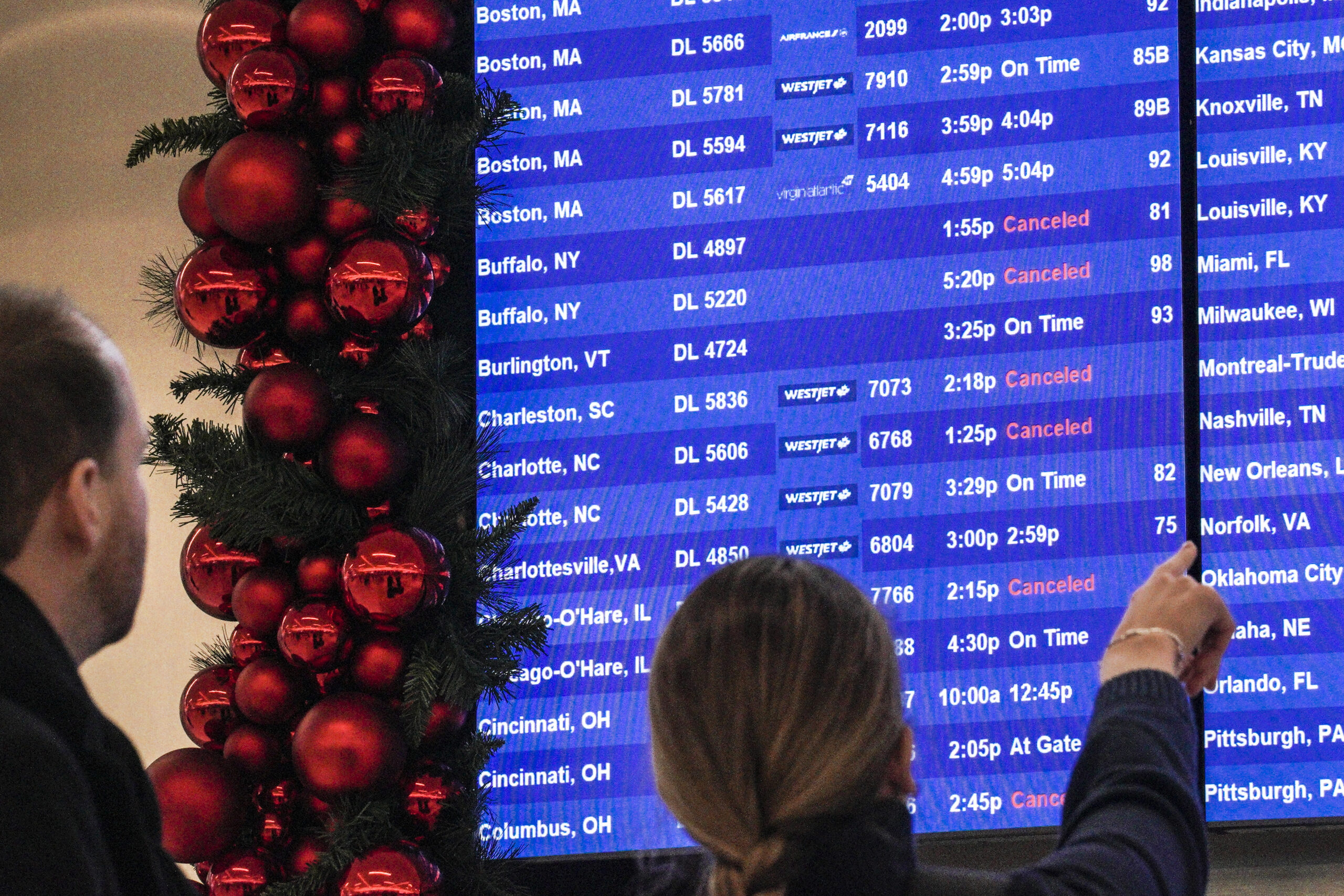 Canceled and delayed flights near 30,000 amid rare bomb cyclone