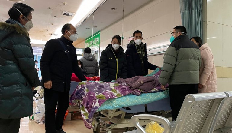 Packed ICUs and crowded crematoriums: COVID-19 roils Chinese towns