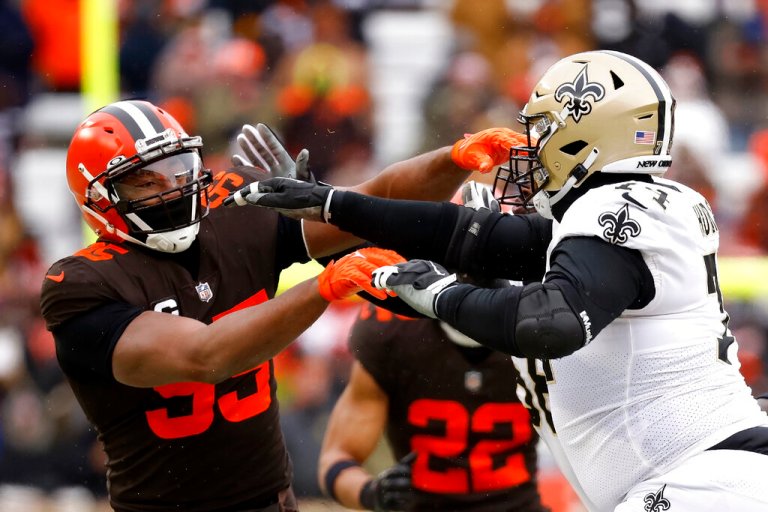 New Orleans Saints offensive tackle James Hurst (74) attempts to block Cleveland Browns defensive end Myles Garrett (95). Garrett was benched for the start of the game for a mystery disciplinary reason.