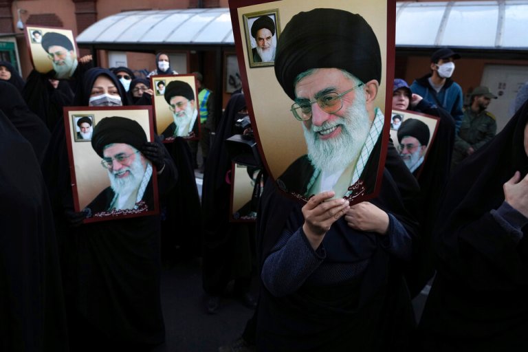 Iranian demonstrators hold posters showing portraits of the Supreme Leader Ayatollah Ali Khamenei and late revolutionary founder Ayatollah Khomeini, top left on the poster, in a protest against French satirical magazine Charlie Hebdo, in front of the French Embassy in Tehran, Iran.