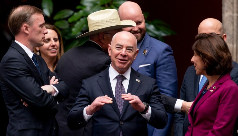 From left, White House national security adviser Jake Sullivan, Homeland Security Secretary Alejandro Mayorkas, and Commerce Secretary Gina Raimondo appear during an arrival ceremony as President Joe Biden arrives to meet with Mexican President Andres Manuel Lopez Obrador at the National Palace in Mexico City, Mexico, Monday, Jan. 9, 2023. 