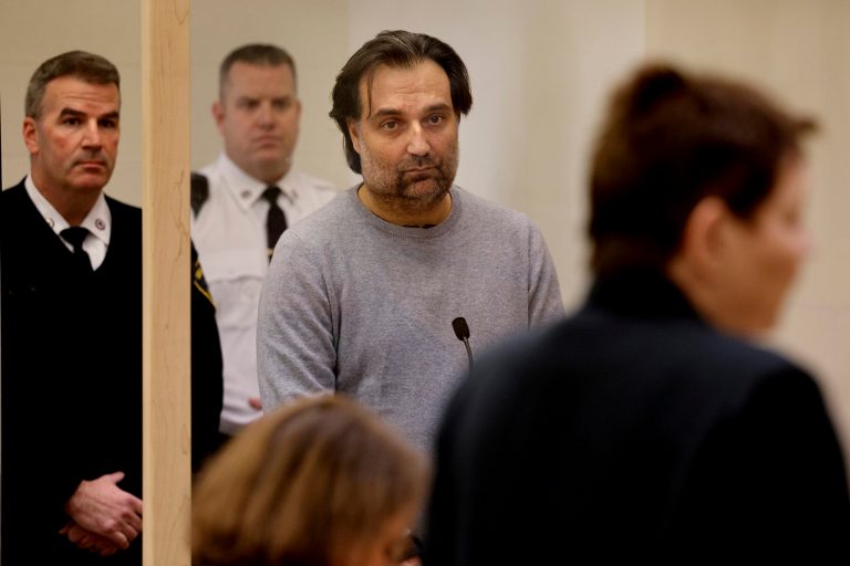 Brian Walshe, center, listens during his arraignment.