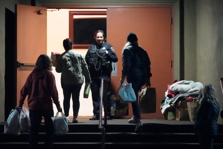 Supplies are carried into a family reunification center after a shooting Monday, Jan. 23, 2023, in Half Moon Bay, California. Multiple people were killed in two related shootings Monday at a mushroom farm and a trucking firm in a coastal community south of San Francisco, and officials say a suspect is in custody. 
