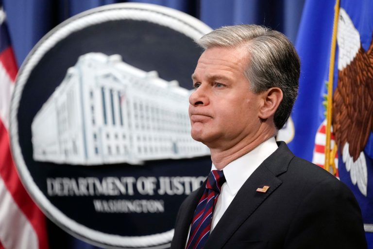 FBI Director Christopher Wray listens during a news conference at the Department of Justice in Washington, Friday, Jan. 27, 2023.