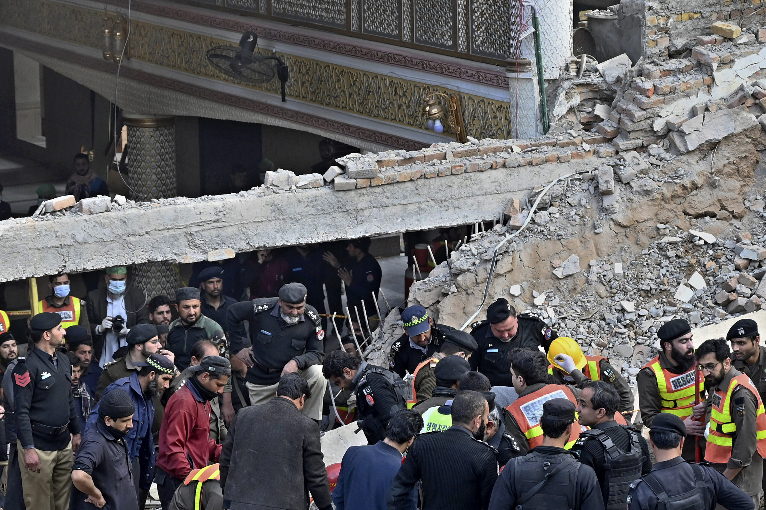 Death toll from Pakistan mosque suicide bombing rises above 90