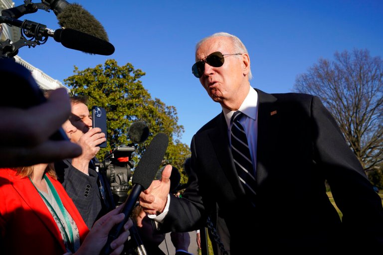 President Joe Biden talks to reporters on the South Lawn of the White House in Washington, Monday, Jan. 30, 2023, after returning from an event in Baltimore on infrastructure. 