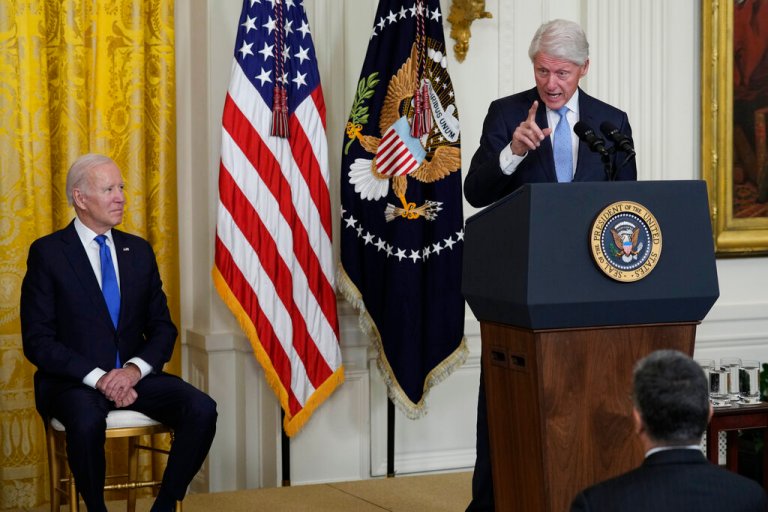 Former President Bill Clinton speaks as President Joe Biden listens during an event in the East Room of the White House in Washington, Thursday, Feb. 2, 2023, to mark the 30thÂ Anniversary of the Family and Medical Leave Act. 