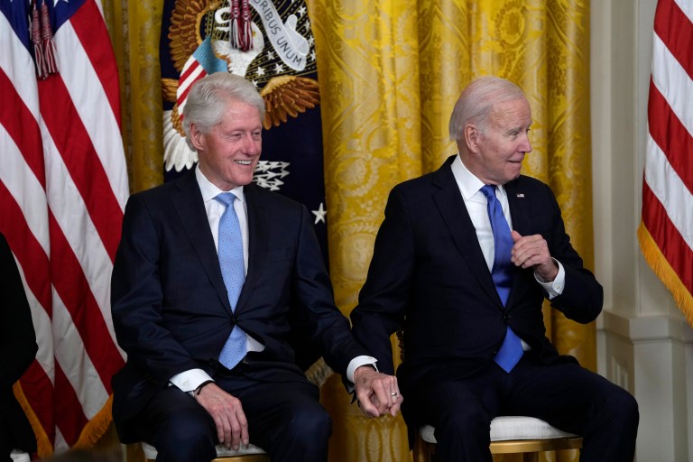 President Joe Biden and former President Bill Clinton listen as Vice President Kamala Harris speaks during an event in the East Room of the White House in Washington. (AP Photo/Susan Walsh)