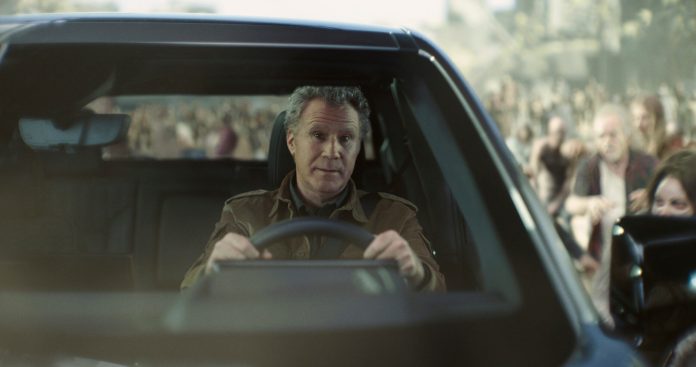 In this photo provided by Netflix/GM, Will Ferrell drives a GMC Sierra EV Denali.