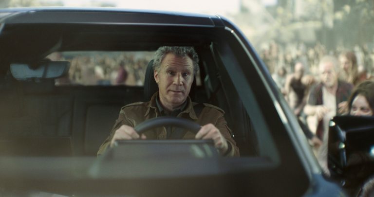 In this photo provided by Netflix/GM, Will Ferrell drives a GMC Sierra EV Denali.