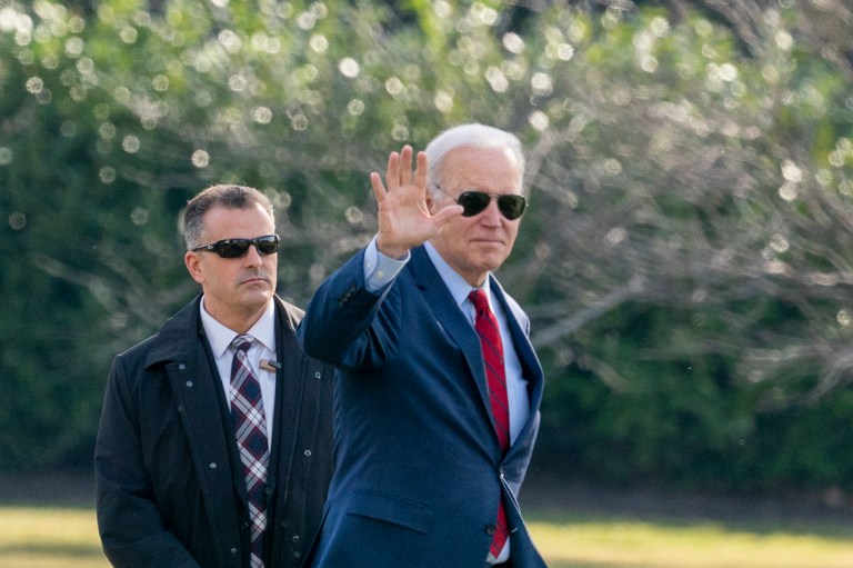 President Joe Biden waves before boarding Marine One on the South Lawn of the White House, Feb. 8, 2023, in Washington. 