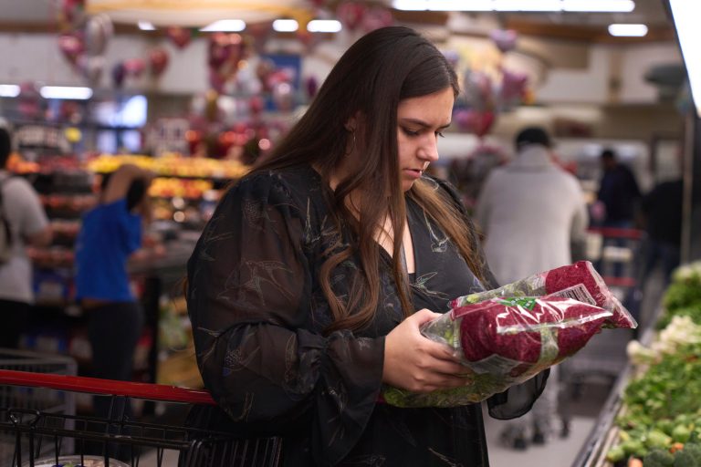 Jaqueline Benitez shops for groceries at a supermarket on Monday, Feb. 13, 2023. 