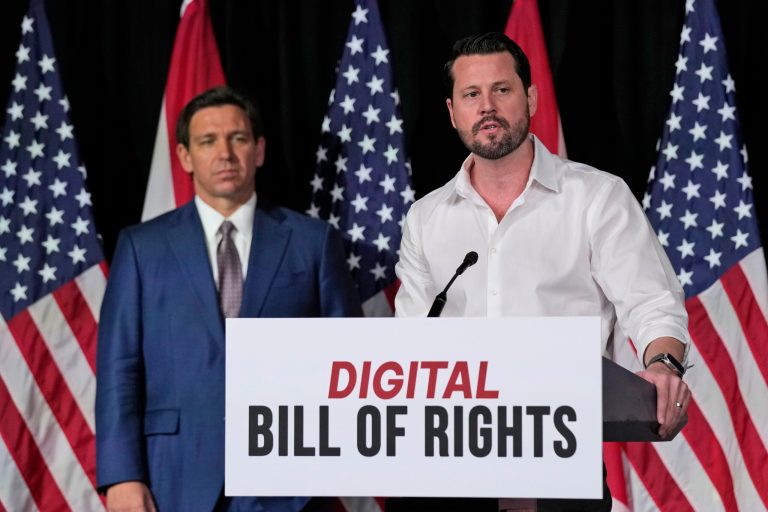 Seth Dillon, owner and operator of a satire site called the Babylon Bee, speaks as Gov. Ron DeSantis (R-FL) looks on after announcing a proposal for the Digital Bill of Rights, Wednesday, Feb. 15, 2023.