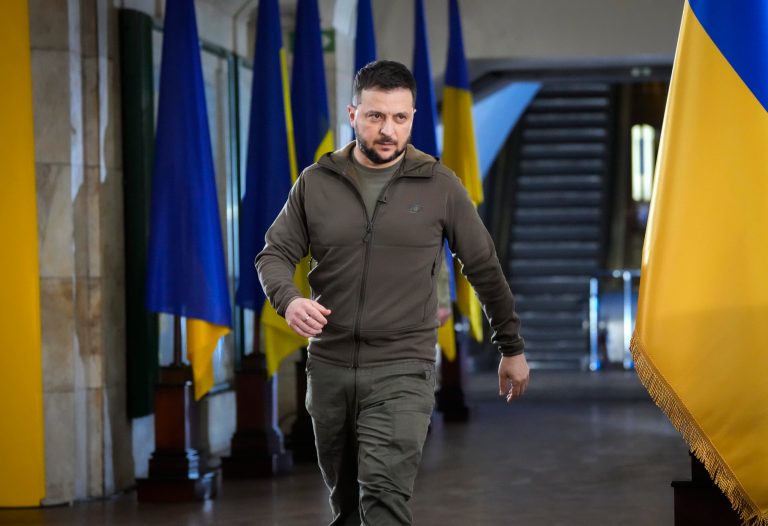 Ukrainian President Volodymyr Zelenskyy walks ahead of a press conference in a city subway under a central square in Kyiv, Ukraine, Saturday, April 23, 2022.