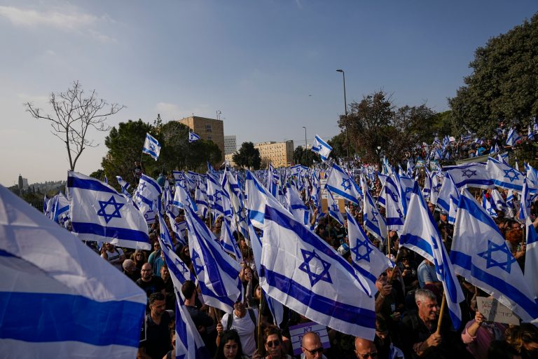 Israelis protest against plans by Prime Minister Benjamin Netanyahu's new government to overhaul the judicial system outside the Knesset, Israel's parliament in Jerusalem, Monday, Feb. 20, 2023. 