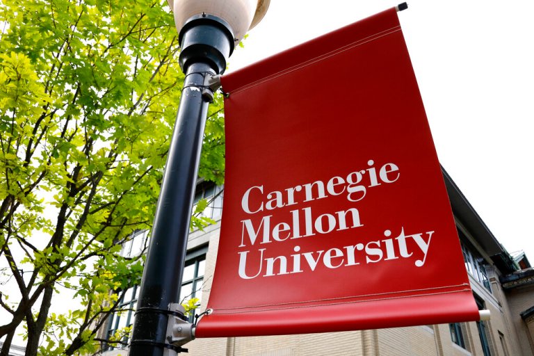 FILE - A Carnegie Mellon University sign is displayed outside Baker Hall on the university's campus in Pittsburgh, June 7, 2019.  (AP Photo/Gene J. Puskar, File)