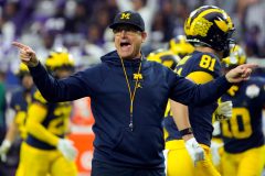 WATCH: Jim Harbaugh helps clear fallen tree from road amid Michigan ice storm