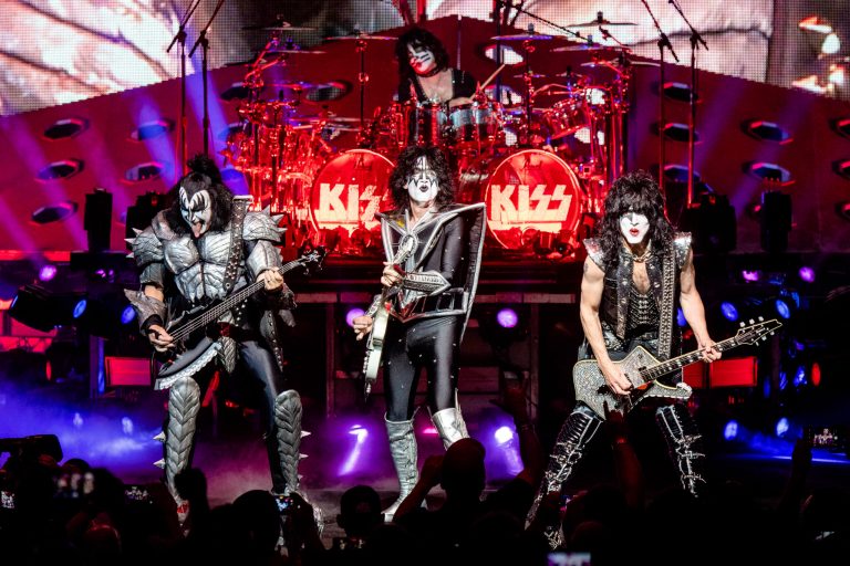 FILE - KISS, foreground from left, Gene Simmons, Tommy Thayer, Paul Stanley, and Eric Singer on drums, performs at the Riverbend Music Center in Cincinnati on Aug. 29, 2019.