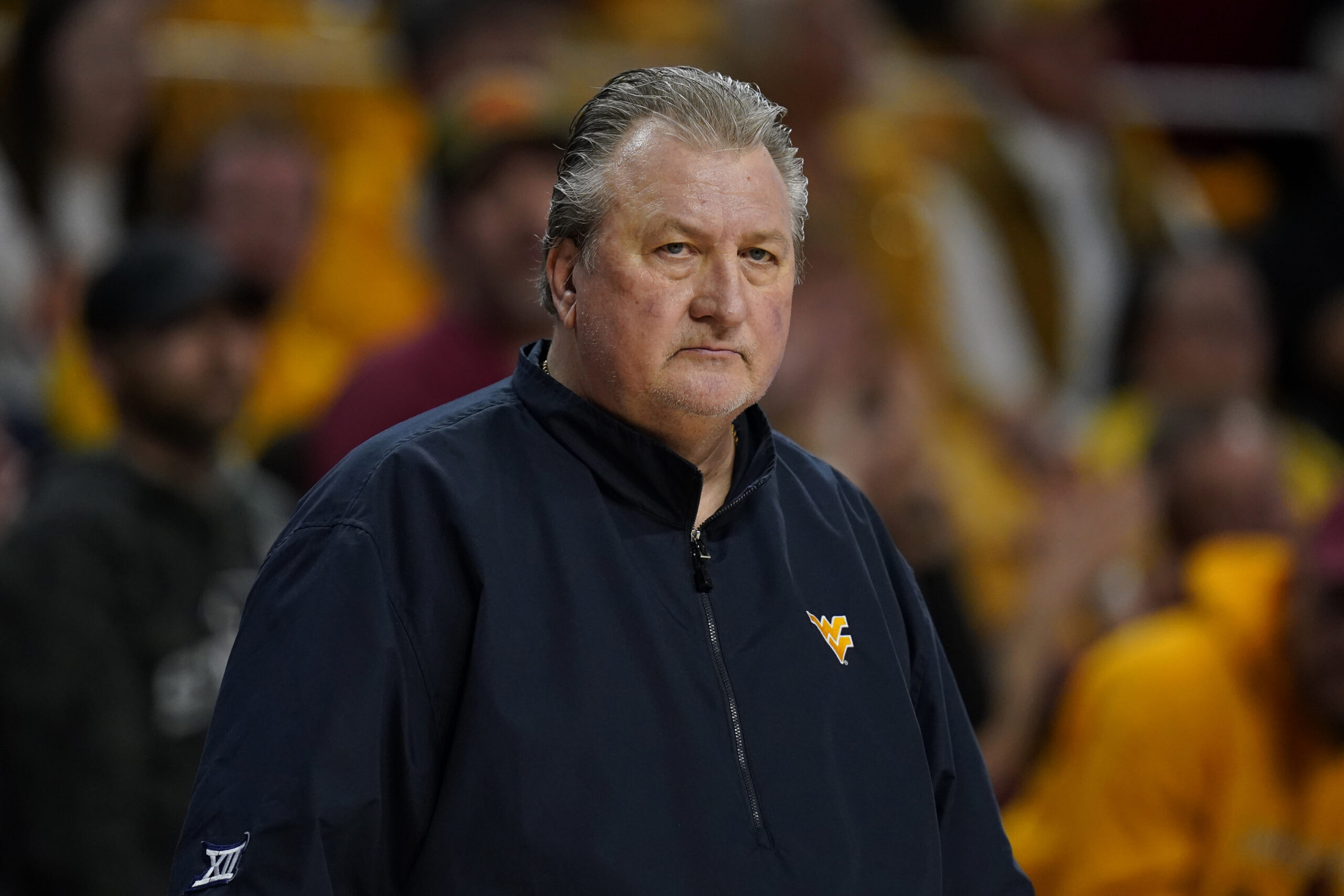 WVU coach agrees to three-game suspension and $1 million salary cut for anti-gay slur