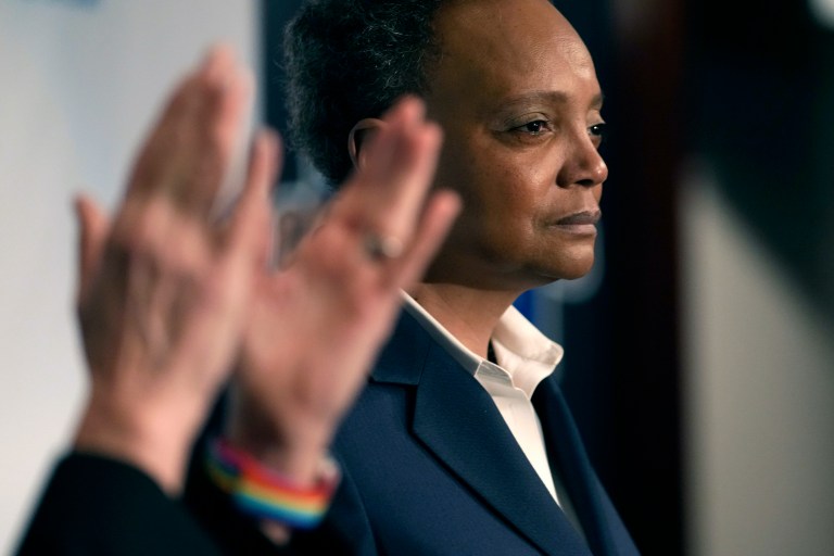 Chicago Mayor Lori Lightfoot pauses during her concession speech as her spouse Amy Eshleman applauds during an election night party for the mayoral election, Tuesday, Feb. 28, 2023, in Chicago.