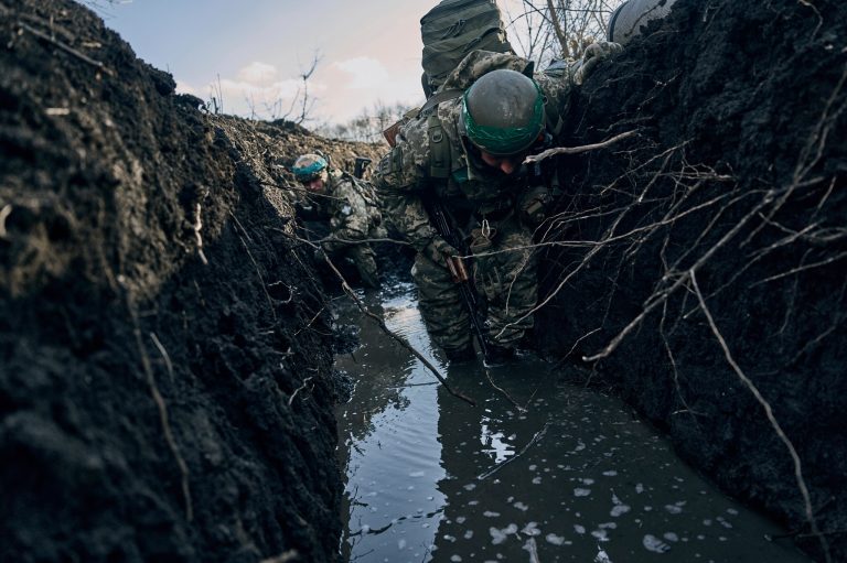 Ukrainian soldiers in a trench under Russian shelling on the front line close to Bakhmut, Donetsk region, Ukraine, Sunday, March 5, 2023. 