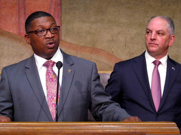 FILE - Transportation and Development Secretary Shawn Wilson, left, speaks about proposed surplus spending on roadwork as Louisiana Gov. John Bel Edwards listens, March 28, 2018, in Baton Rouge, La.