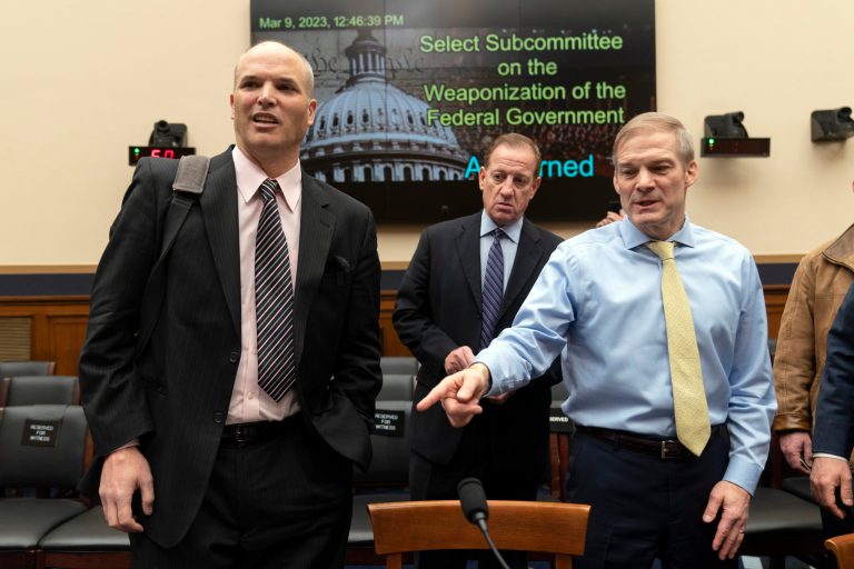 Chairman Jim Jordan, R-Ohio, talks to witness Matt Taibbi, left, at the conclusion of a House Judiciary subcommittee hearing on what Republicans say is the politicization of the FBI and Justice Department and attacks on American civil liberties, on Capitol Hill in Washington, Thursday, March 9, 2023. 