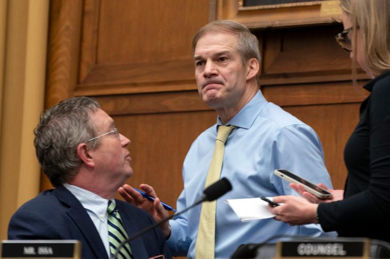 Chairman Jim Jordan (R-OH) speaks with Rep. Thomas Massie (R-KY) during a House Judiciary subcommittee hearing on what Republicans say is the politicization of the FBI and Justice Department and attacks on American civil liberties on Capitol Hill in Washington, D,C., on Thursday, March 9, 2023. 