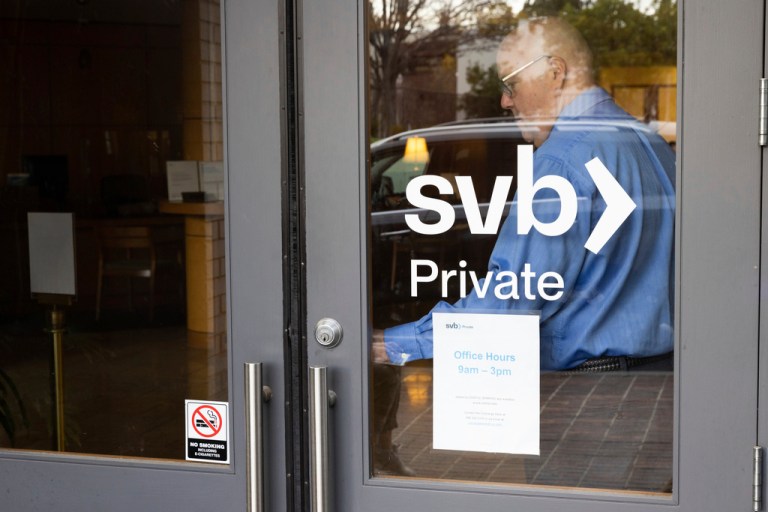 Complex Financial Institution Resolution Specialist Brian J. Teitel exits a Silicon Valley Bank to speak with customers waiting in line in Palo Alto, Calif., on Monday, March 13, 2023. The federal government intervened Sunday to secure funds for depositors to withdraw from Silicon Valley Bank after the banks collapse. Several individuals waited in line before the bank opened to withdraw funds.