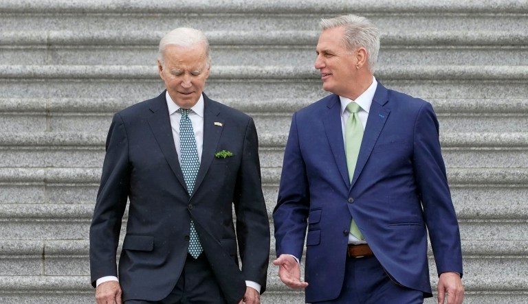 President Joe Biden and House Speaker Kevin McCarthy of Calif., walk down the House steps after attending an annual St. Patrick's Day luncheon gathering, Friday, March 17, 2023, on Capitol Hill in Washington. 