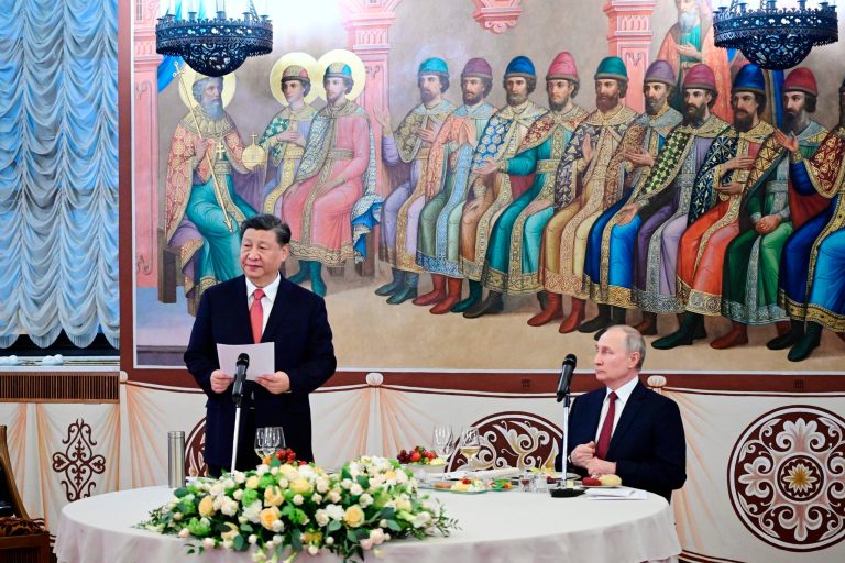 Chinese President Xi Jinping, left, deliver his speech as Russian President Vladimir Putin listens to him during their dinner at The Palace of the Facets in the Moscow Kremlin, Russia, Tuesday, March 21, 2023.
