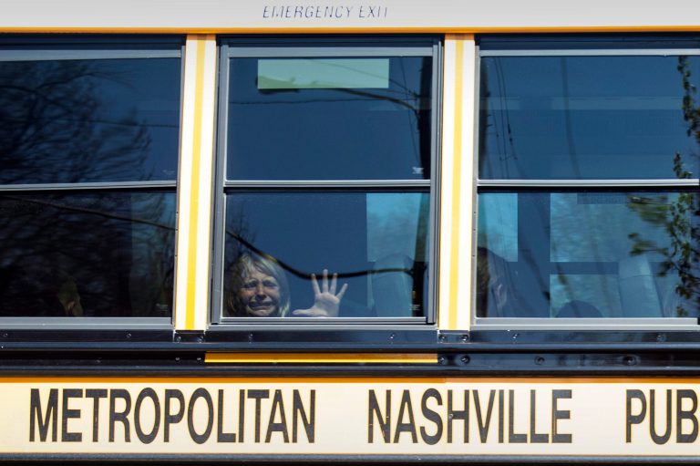 A child weeps while on the bus leaving The Covenant School following a mass shooting at the school in Nashville, Tenn., Monday, March 27, 2023. 