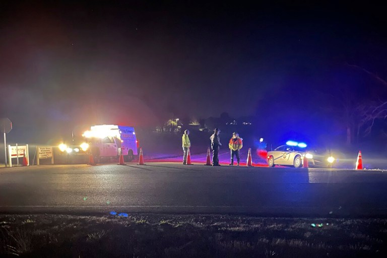 Emergency responders are seen near a site where two military helicopters crashed Wednesday night during a routine training mission in Trigg County, in southwestern Kentucky, on March 30, 2023. 