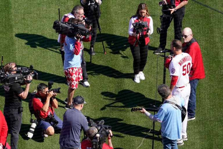 St. Louis Cardinals pitcher Adam Wainwright sings the Star-Spangled Banner before the start of an opening day baseball game between the Cardinals and the Toronto Blue Jays Thursday, March 30, 2023, in St. Louis.