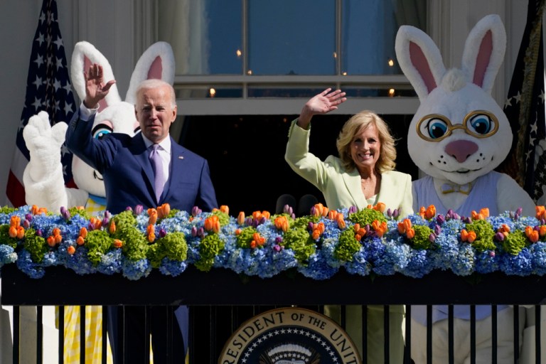 President Joe Biden and first lady Jill Biden stand on the Blue Room Balcony as they attend the 2023 White House Easter Egg Roll, Monday, April 10, 2023, in Washington.