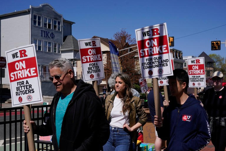 Strikers march in front of Rutgers' buildings in New Brunswick, N.J., Monday, April 10, 2023. Thousands of professors, part-time lecturers, and graduate student workers at New Jersey's flagship university have gone on strike â the first such job action in the school's 257-year history. 