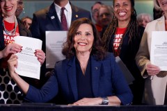 Michigan governor signs universal background check and firearm safe storage laws