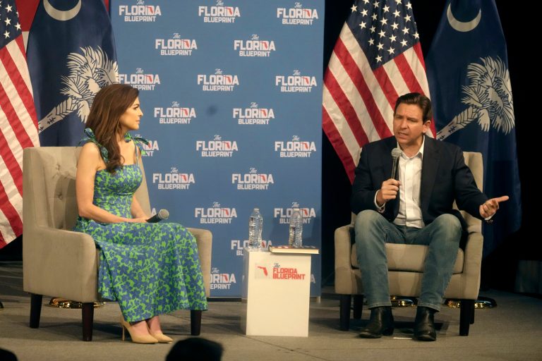 Casey DeSantis, left, looks on as her husband, Gov. Ron DeSantis, R-Fla., speaks to a crowd at First Baptist North on Wednesday, April 19, 2023, in Spartanburg, S.C. 