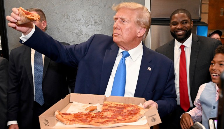 Trump offers energized crowd half-eaten slice of pizza after speech in Florida