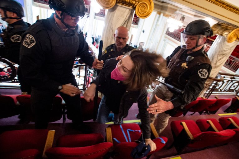 Law enforcement forcibly clear the Montana House of Representatives gallery during a protest after the Speaker of the House refused again to acknowledge Rep. Zooey Zephyr, D-Missoula, on Monday, April 24, 2023, in the State Capitol in Helena, Montana. Republican legislative leaders in Montana persisted in forbidding the Democratic transgender lawmaker from participating in debate for a second week as her supporters brought the House session to a halt Monday, chanting 