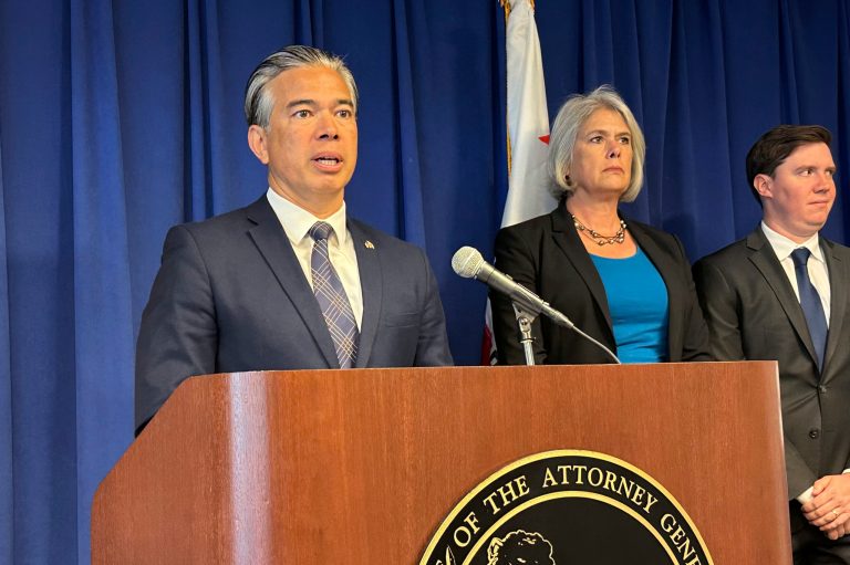 California Attorney General Rob Bonta, left, speaks during a news conference in Sacramento, Calif., on Monday, May 1, 2023.