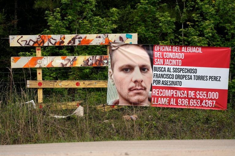 A posted wanted sign for a mass shooting suspect is shown Tuesday, May 2, 2023, in the neighborhood where the shooting occurred Friday, in Cleveland, Texas.