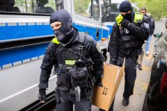 German police raid climate activists who stopped traffic and vandalized art