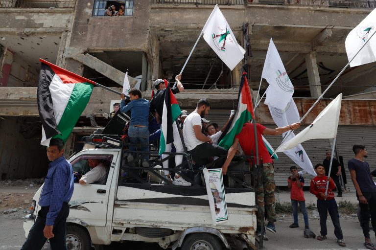 People attend the funeral of five members of a Palestinian militant group Popular Front for the Liberation of Palestine-General Command members on Thursday, June 1, 2023, in Damascus, Syria.