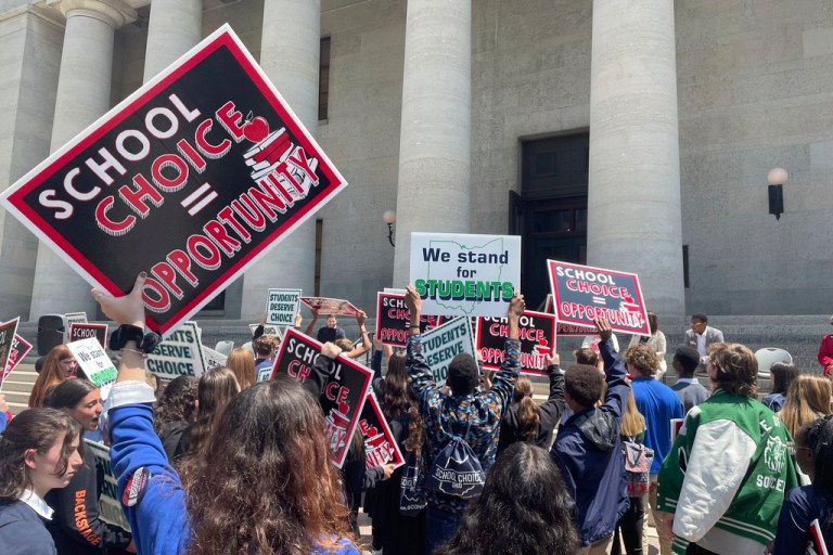 Students and parents rally at the Ohio Statehouse in support of possible changes that would increase eligibility for taxpayer-funded school vouchers to K-12 students statewide on Thursday, May 17, 2023, in Columbus, Ohio.