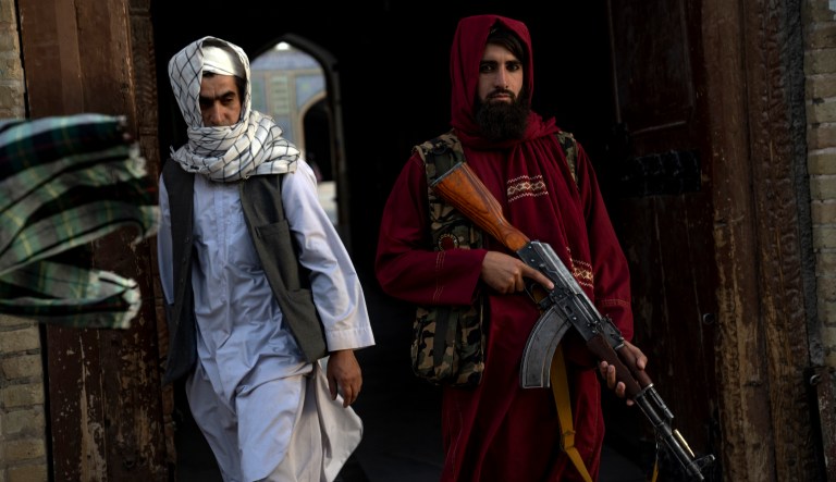 A Taliban fighter stands guard in front of the Jama Masjid mosque also known as Great Mosque in Herat, Afghanistan, Thursday, June 1, 2023.